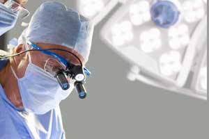 Vascular Surgeon operating during microvascular surgery