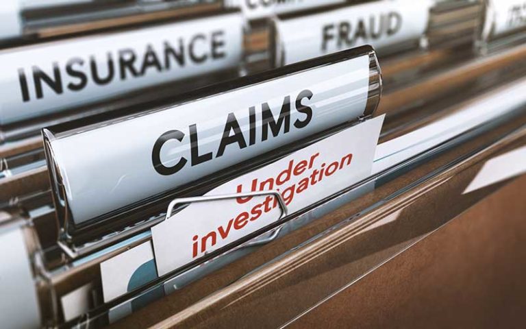false insurance claims under investigation file folders
